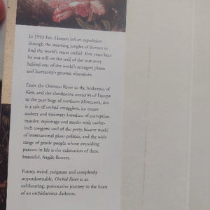 Book page with text and a small illustration on a plain background
