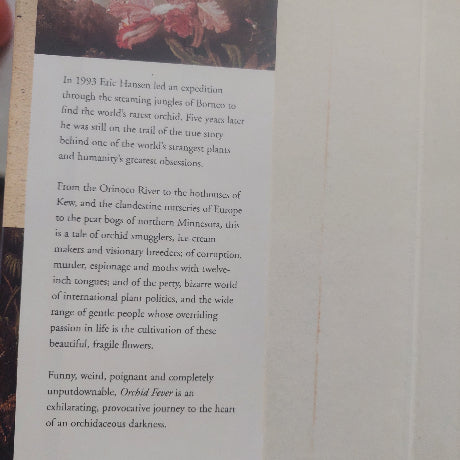 Book page with text and a small illustration on a plain background