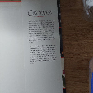 Open book with text on a wooden surface
