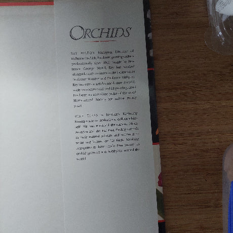 Open book with text on a wooden surface