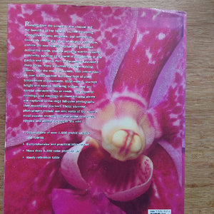 Book cover with a pink orchid on a wooden surface